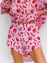 Shorts casuales con bolsillos y estampado de plantas fluidos